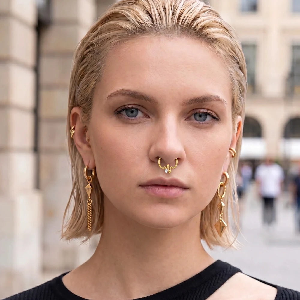 woman wearing pvd gold molten septum clicker y2k style tipiercing